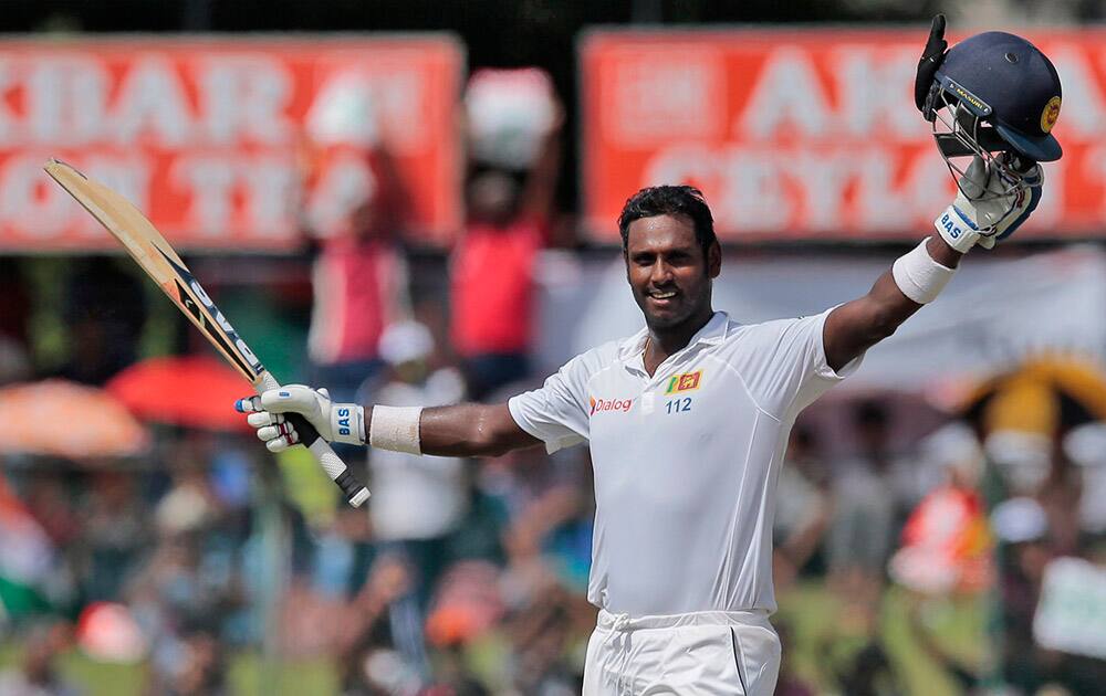 Sri Lanka's captain Angelo Mathews celebrates scoring a century during the third day's play of the second test cricket match against India in Colombo, Sri Lanka.