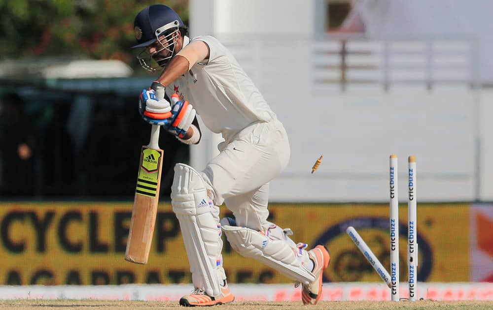 Lokesh Rahul bowls out off Sri Lanka's Dhammika Prasad, not pictured, during the third day's play of the second test cricket match between them in Colombo, Sri Lanka.