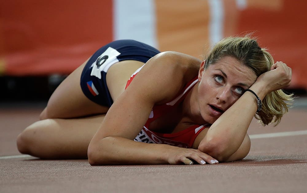 Czech Republic's Eliska Klucinova looks at her time after running in the women’s 200m heptathlon at the World Athletics Championships at Bird's Nest stadium in Beijing.