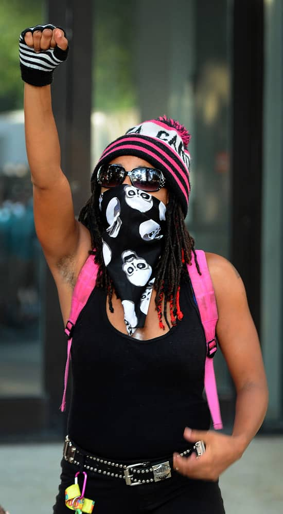 A woman raises her fist in support of Jonathan Ferrell in Charlotte, N.C. 