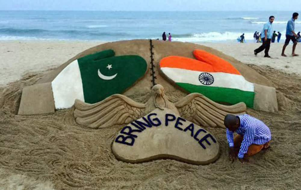 Sand artist Sudarsan Pattnaik creats a sculpture on INDO- PAK issue with a message “Bring Peace” at Puri beach of Odisha.