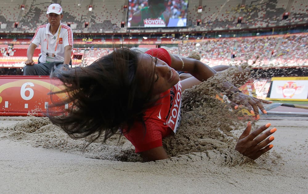 United States' Erica Bougard lands in the sand pit as she competes in the women's long jump heptathlon at the World Athletics Championships at the Bird's Nest stadium in Beijing.