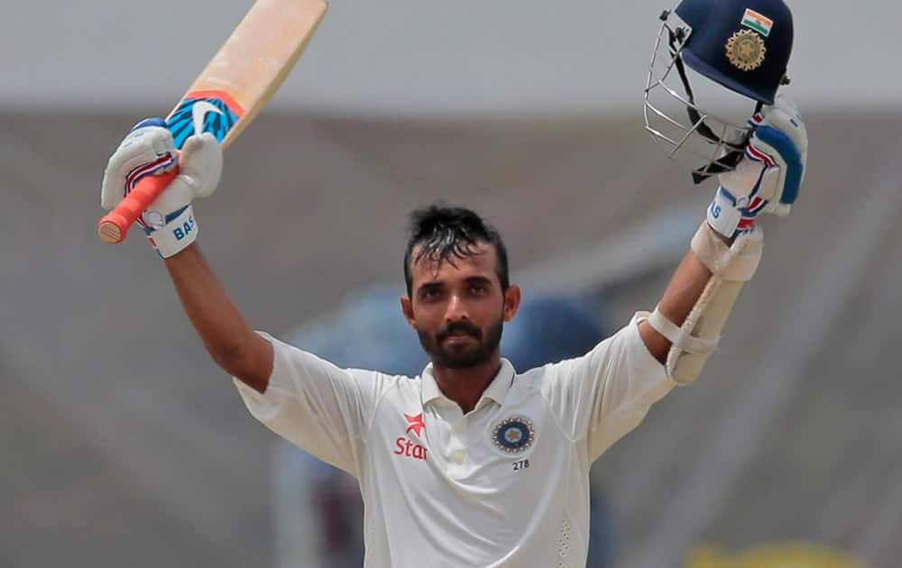 India's Ajinkya Rahane celebrates scoring a hundred during the fourth day's play of the second test cricket match between Sri Lanka and India in Colombo, Sri Lanka.