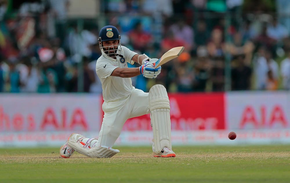 India's Ajinkya Rahane plays a shot during the fourth day's play of the second test cricket match between Sri Lanka and India in Colombo, Sri Lanka.