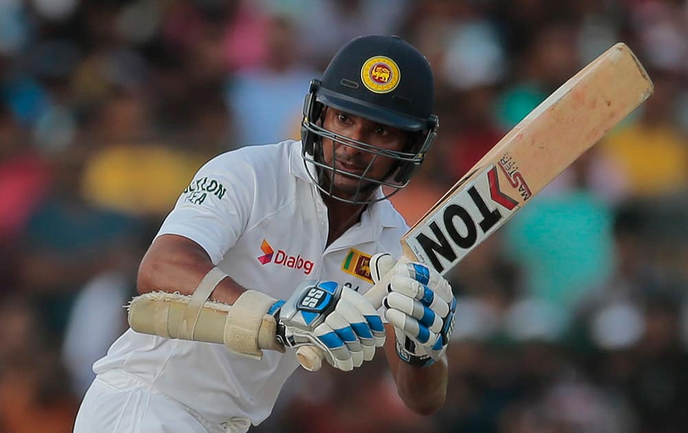 Sri Lanka national team player Kumar Sangakkara watches his shot during the fourth day's play of the second test cricket match between Sri Lanka and India in Colombo, Sri Lanka