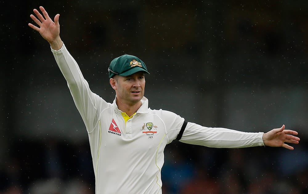 Australia’s captain Michael Clarke directs his players on the fourth day of the fifth Ashes Test match between England and Australia, at the Oval cricket ground in London.