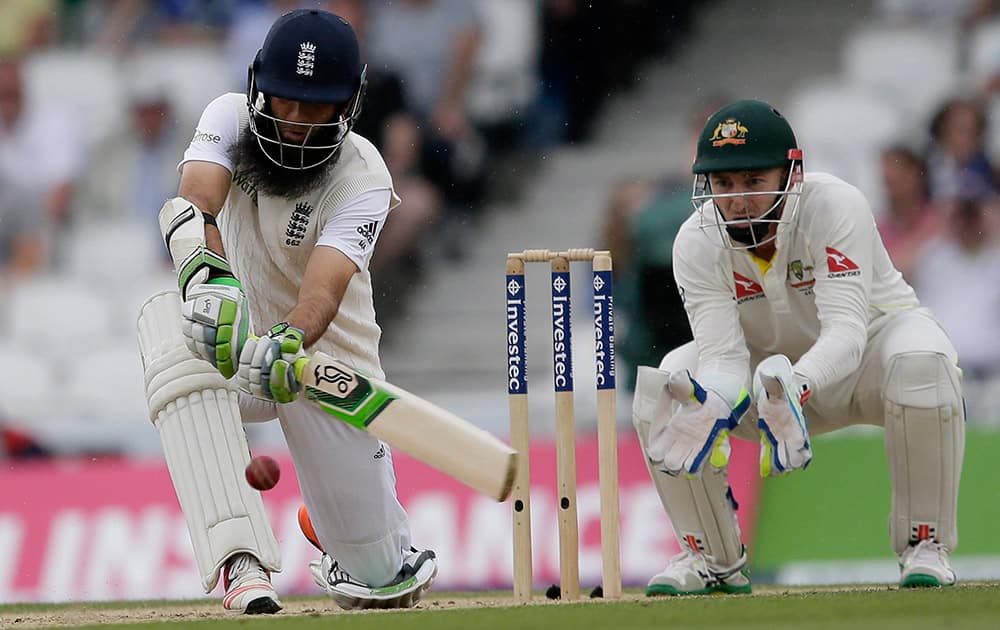 England’s Moeen Ali plays a shot off the bowling of Australia’s Nathan Lyon on the fourth day of the fifth Ashes Test match between England and Australia, at the Oval cricket ground in London.