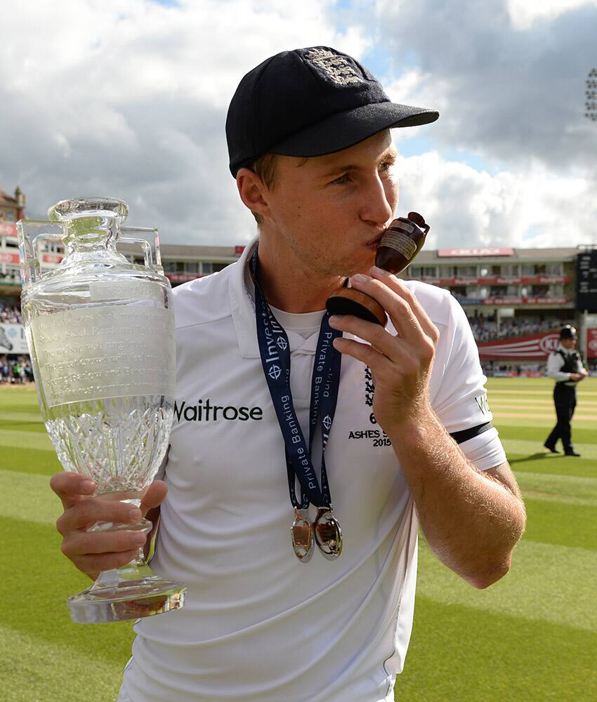 England’s Joe Root kisses the Ashes Urn as he poses for a photograph following a presentation ceremony on the forth day of the fifth Ashes cricket test between England and Australia at the Oval cricket ground in London.