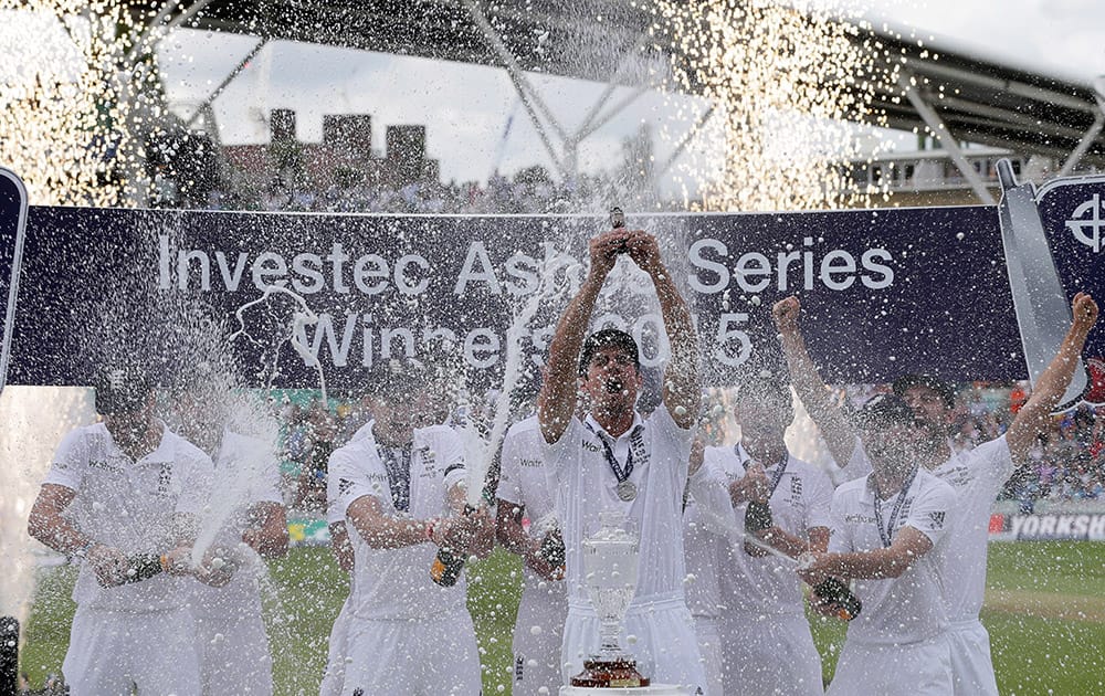 England’s captain Alastair Cook holds up the Ashes Urn during the presentation ceremony on the forth day of the fifth Ashes cricket test between England and Australia at the Oval cricket ground in London.