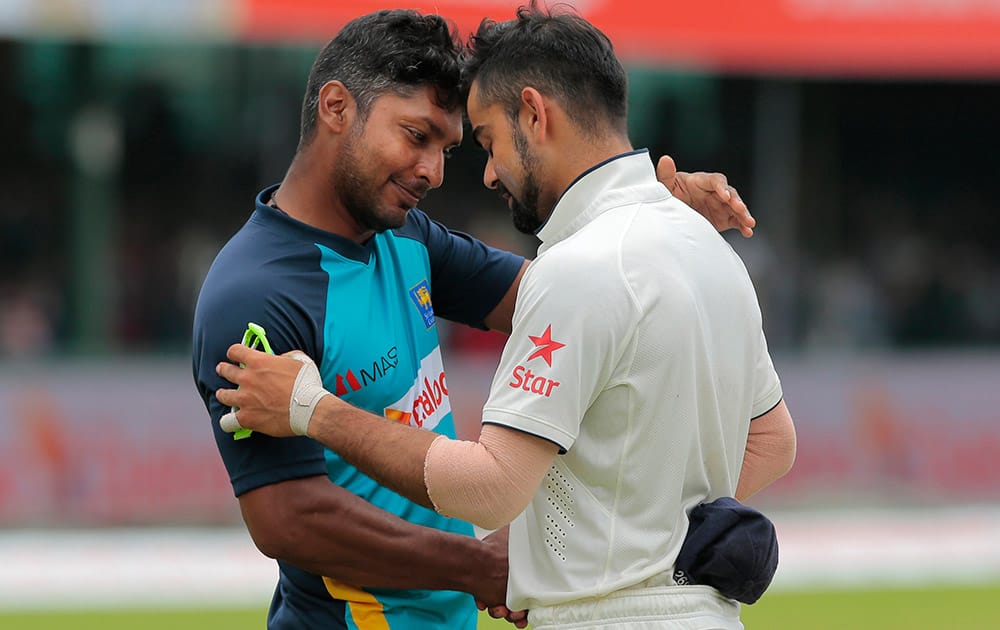 Indian cricket captain Virat Kohli greets Sri Lankan cricketer Kumar Sangakkara after the second test cricket match between Sri Lanka and India in Colombo, Sri Lanka.