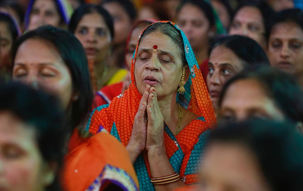 A member of India's Jain community offers prayers during a protest in Mumbai.