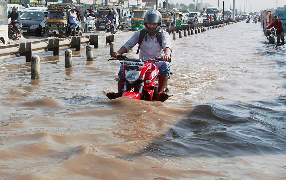 Waterlogging at Hero Honda Chowk at Delhi-Gurgaon Expressway after heavy rains in Gurgaon.