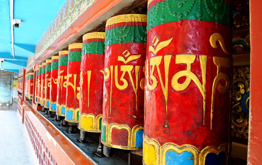 Constantly spinning Buddhist prayer wheels.