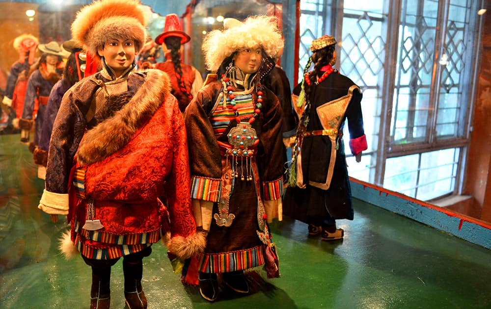 Tribal Tibetan couple at the Doll's Museum, Norbulingka.