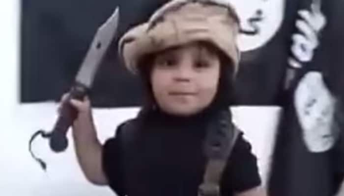 Disturbing video shows toddler decapitating teddy bear in front of ISIS flag