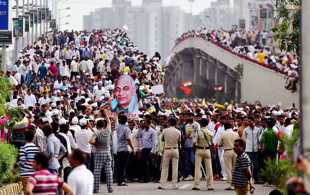 Members of the Patel (Patidar) community carry a cut-out of Sardar Vallabhbhai Patel during a meeting and mega rally to press for their demands of reservation.