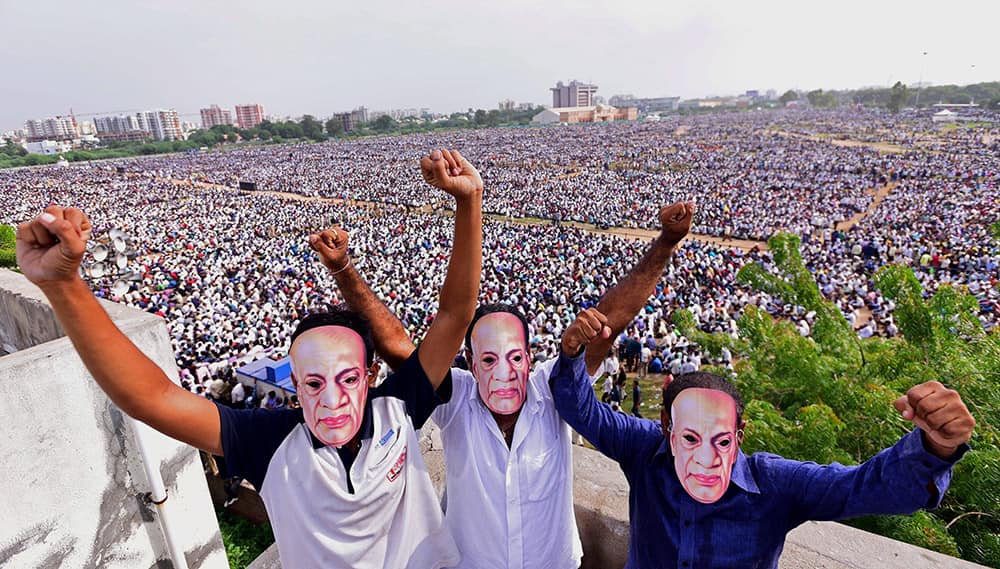 Members of Patel (Patidar) community wearing mask of Sardar Vallabhbhai Patel during the Kranti rally (revolution march) to press their demands for reservation, at GMDC Ground in Ahmedabad.