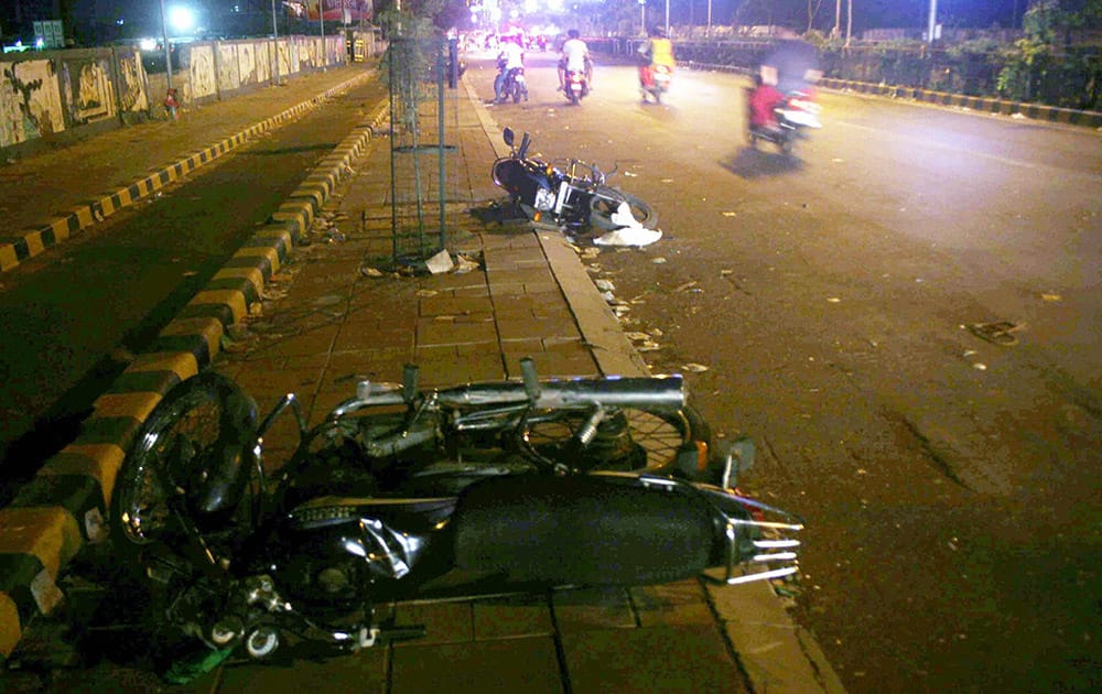 Motorbikes damaged by people after the arrest of Hardik Patel, convener of Patidar Anamat Andolan Samiti, in Ahmedabad.