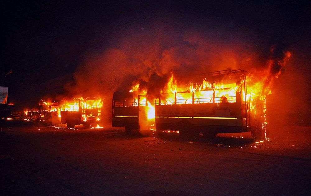 Buses set on fire in Surat on Tuesday night by people after the arrest of Hardik Patel, convener of Patidar Anamat Andolan Samiti.