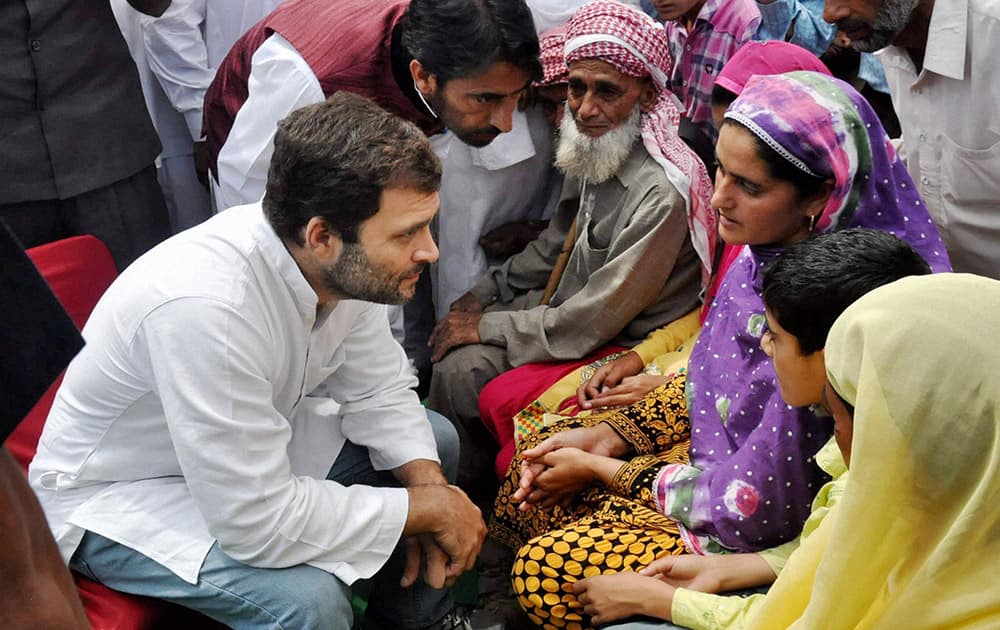 Congress Vice President Rahul Gandhi with JKPCC President Ghulam Ahmad Mir meeting with the people affected by Pakistani firing in areas along the Line of Control at Balakot sector in Poonch.