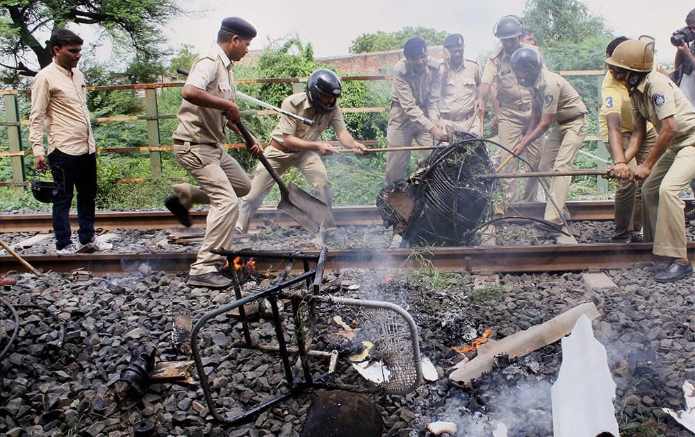 Police force clearing a railway track that was blocked by agitating Patel community in Ahmedabad.