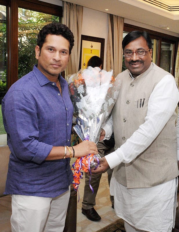Sachin Tendulkar with Maharashtra Finance and Forest Minister Sudhir Mungantiwar during a meeting at Tendulkars residence in Mumbai. The latter offered a letter requesting Tendulkar to be the brand ambassaor of Save the forest and tiger initiative of Maharashtra government. 