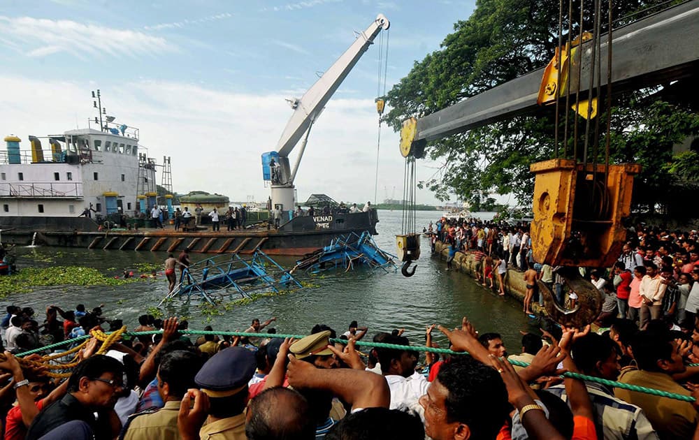 Coast Guard, Navy and Marine police and local fishermen carry out rescue work after a passenger boat collided with a fishing boat and capsized off Fort Kochi.