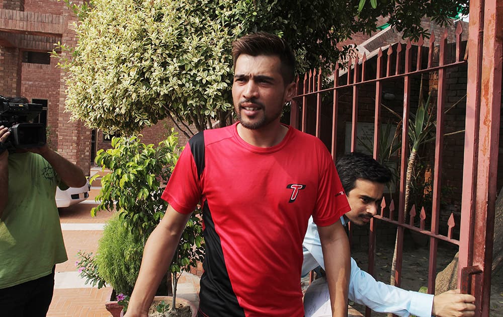 Pakistani cricketer Mohammad Amir arrives at the Pakistan Cricket Boards headquarters in Lahore, Pakistan.