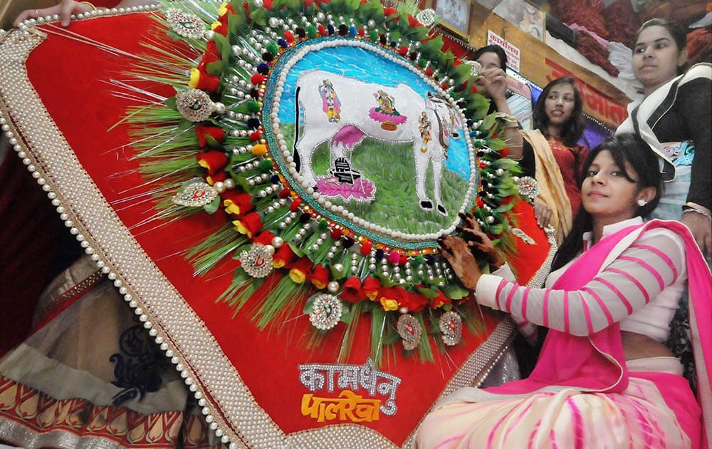 Women preparing a huge Rakhi in Indore on Wednesday ahead of the festival.
