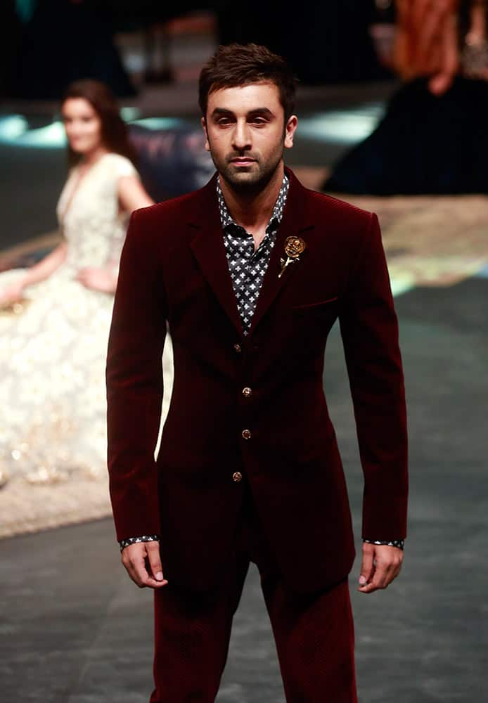 Bollywood actor Ranbir Kapoor displays a creation by designer Manish Malhotra, during Lakme Fashion Week in Mumbai, India.