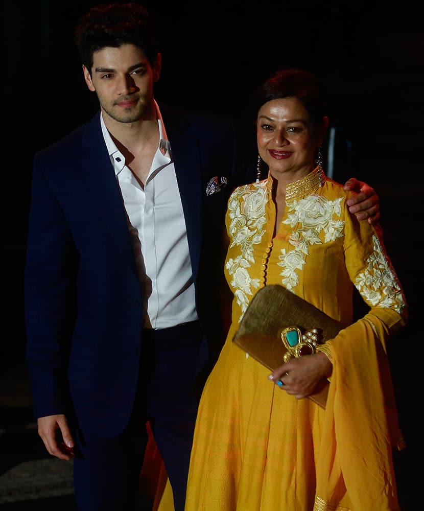 Bollywood actor Sooraj Pancholi left, along with his mother Zarina Wahab posses for a picture during the Lakme Fashion Week in Mumbai.