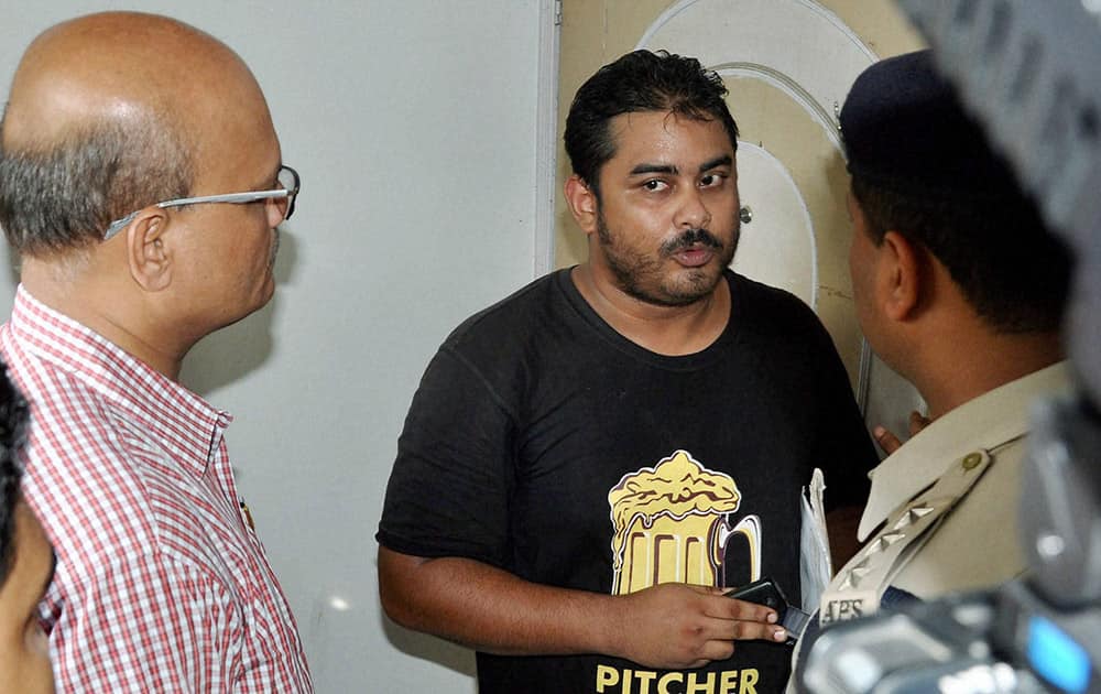 Mumbai Police personnel talks to Mikail Bora, son of Media tycoon Indrani Mukerjea, in connection with his sister Sheena Boras murder case at their residence at Sundarpur in Guwahati.