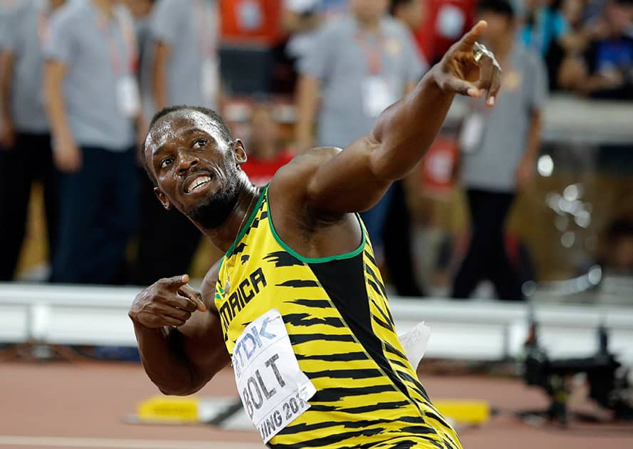 Jamaica's Usain Bolt celebrates after winning the gold in the men's 200m final at the World Athletics Championships at the Bird's Nest stadium in Beijing.