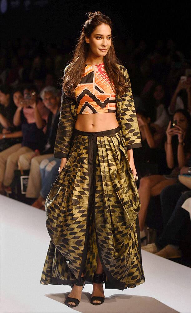 Model and actress Lisa Haydon walks the ramp during the Lakme Fashion Week in Mumbai.