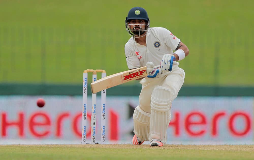 Virat Kohli plays a shot against Sri Lanka on the day one of their third test cricket match in Colombo, Sri Lanka.