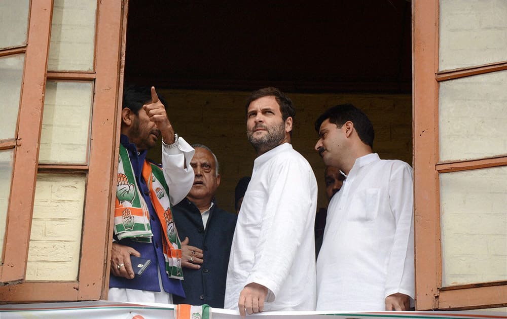 Congress Vice President Rahul Gandhi is briefed by JKPCC chief Ghulam Ahmad Mir about the devastation by the last years floods, at the party headquarters in Srinagar.