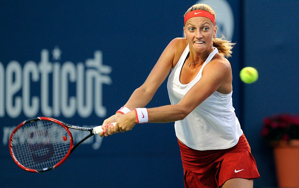 Petra Kvitova, of the Czech Republic, reaches for a backhand against Caroline Wozniacki, of Denmark, during the semifinals of the Connecticut Open tennis tournament in New Haven.