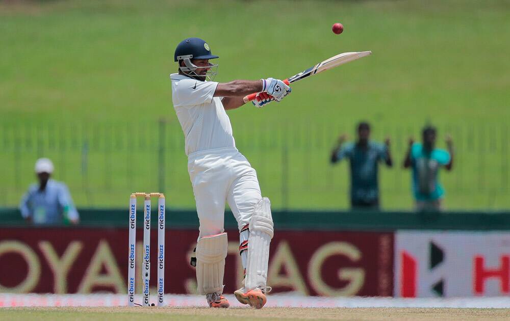 Cheteshwar Pujara, bats on the second day of their third test cricket match against Sri Lanka in Colombo, Sri Lanka.