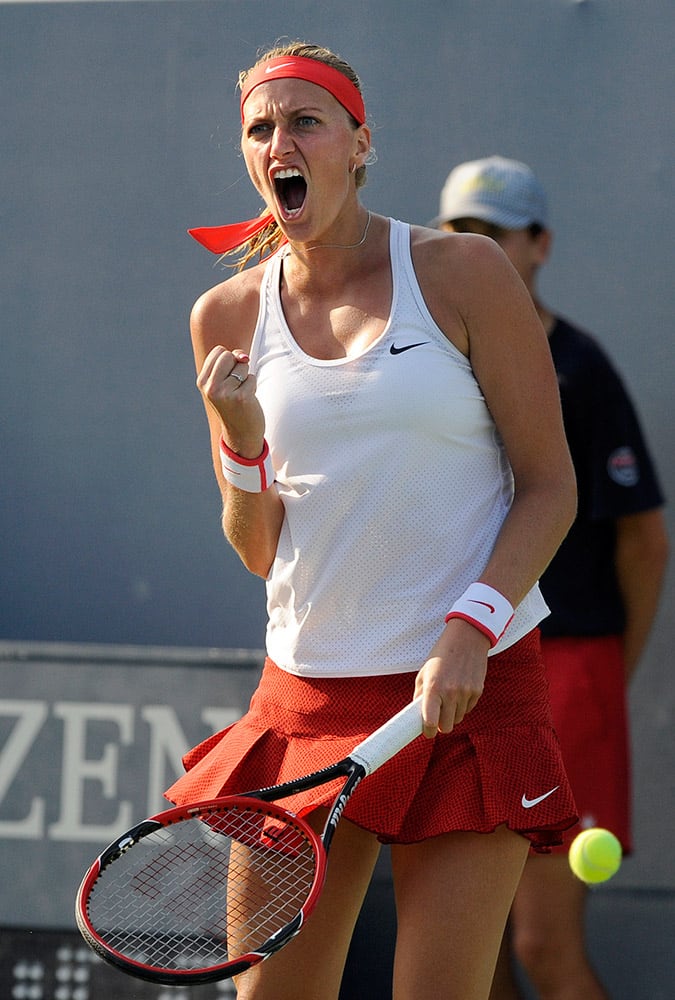 Petra Kvitova, of the Czech Republic, celebrates during the third set of her 6-7 (6), 6-2, 6-2 victory over countrywoman Lucie Safarova in the final of the Connecticut Open tennis tournament in New Haven, Conn.