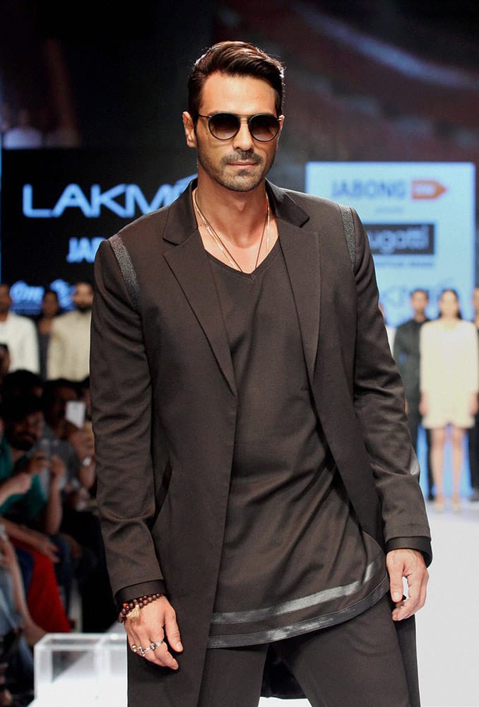 Bollywood actor Arjun Rampal showcases a creation by designer Bugatti during Lakme Fashion Week in Mumbai.