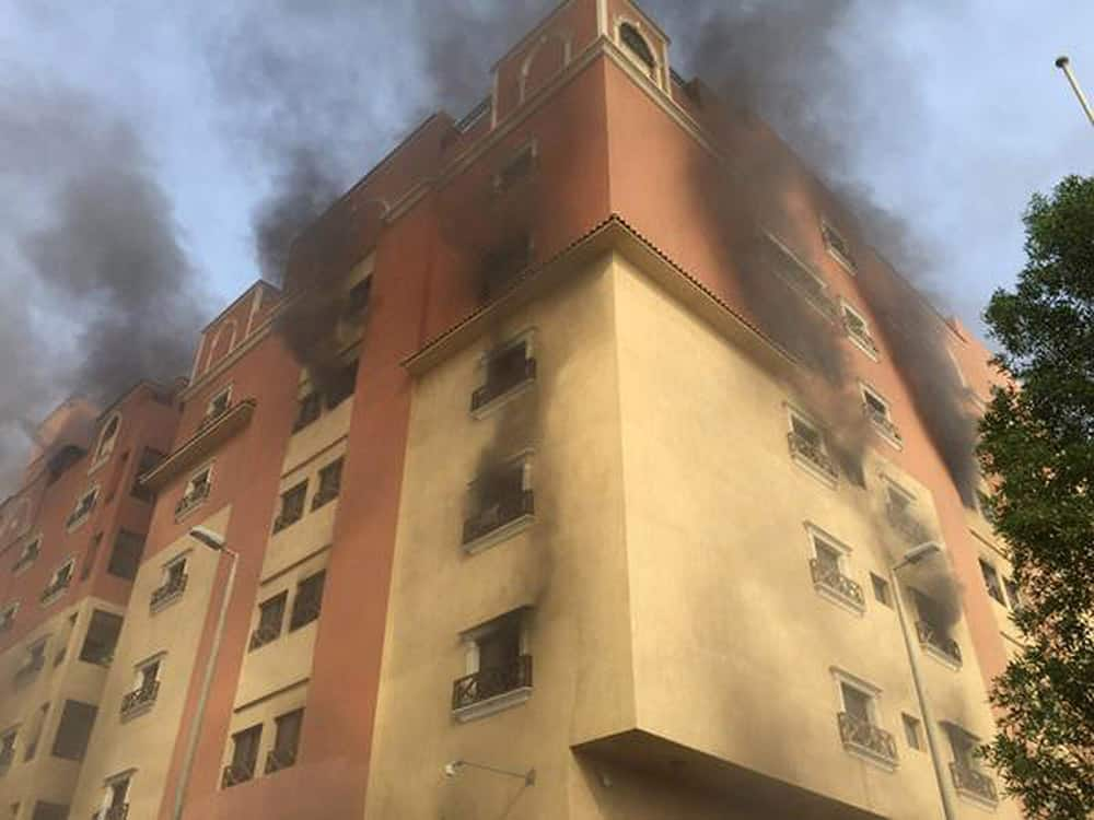 In this image released by the Saudi Interior Ministry’s General Directorate of Civil Defense, smoke billows from a fire at a residential complex used by state oil giant Saudi Aramco in Khobar, Saudi Arabia.