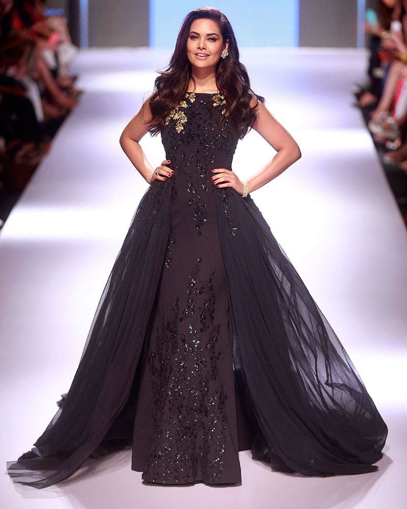 Bollywood actress Esha Gupta displays a creation by designer Ridhi Mehra during the Lakme Fashion Week in Mumbai.