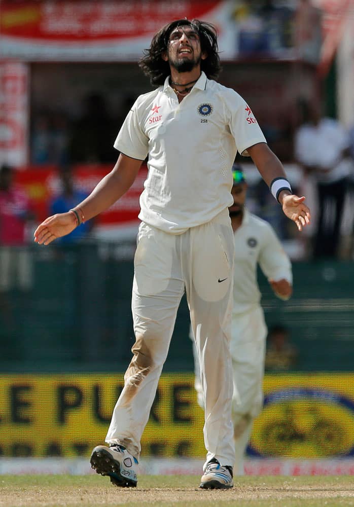 India's Ishant Sharma celebrates taking the wicket of Sri Lanka's Rangana Herath on the third day of their third test cricket match between them in Colombo, Sri Lanka.