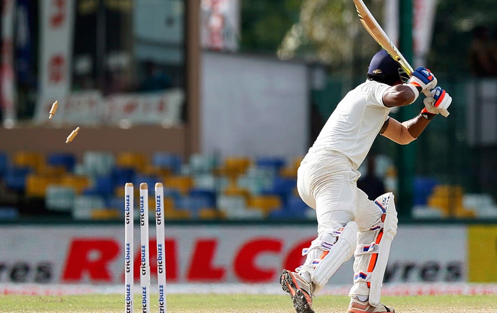 India's Lokesh Rahul is bowled out off a delivery by Sri Lanka's Nuwan Pradeep on the third day of their third test cricket match between them in Colombo, Sri Lanka.