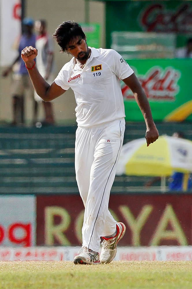 Sri Lanka's Nuwan Pradeep celebrates the dismissal of India's Lokesh Rahul on the third day of their third test cricket match between them in Colombo, Sri Lanka.