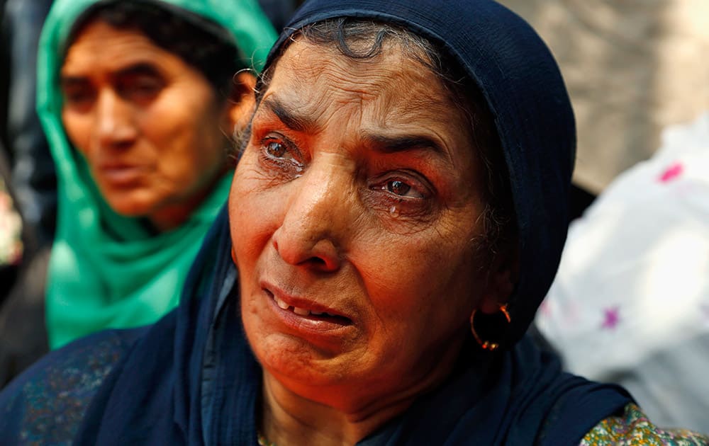 A mother of a missing Kashmiri youth cries during a protest organized by the Association of Parents of Disappeared (APDP) in Srinagar, India.
