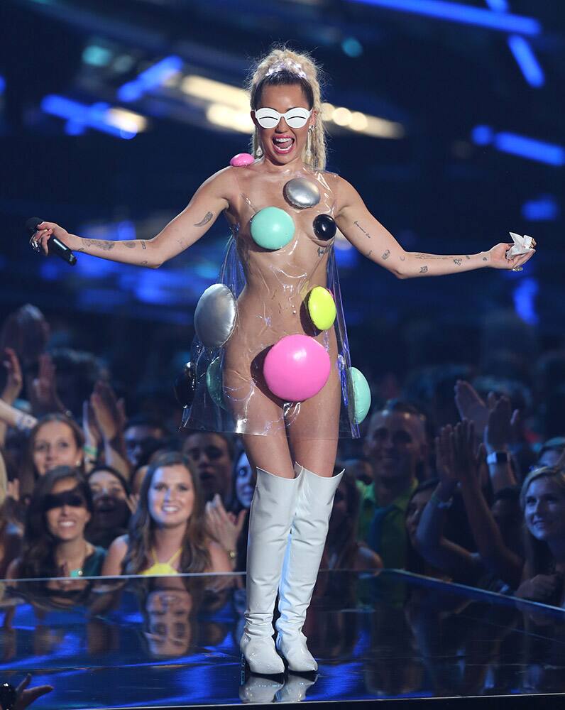 Host Miley Cyrus appears at the MTV Video Music Awards at the Microsoft Theater in Los Angeles. 