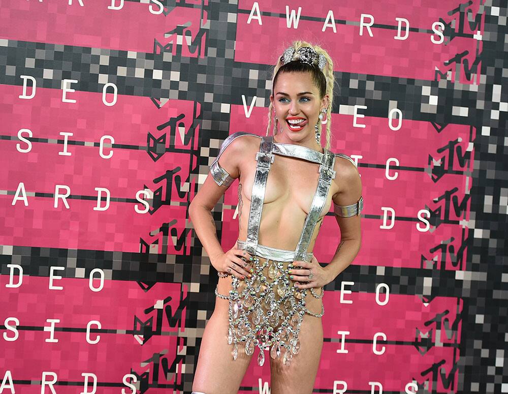 Miley Cyrus arrives at the MTV Video Music Awards at the Microsoft Theater.