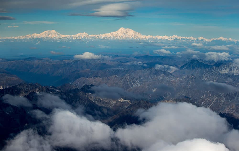 The newly-renamed Denali, top center, is seen from a window of Air Force One on approach to Anchorage, Alaska.