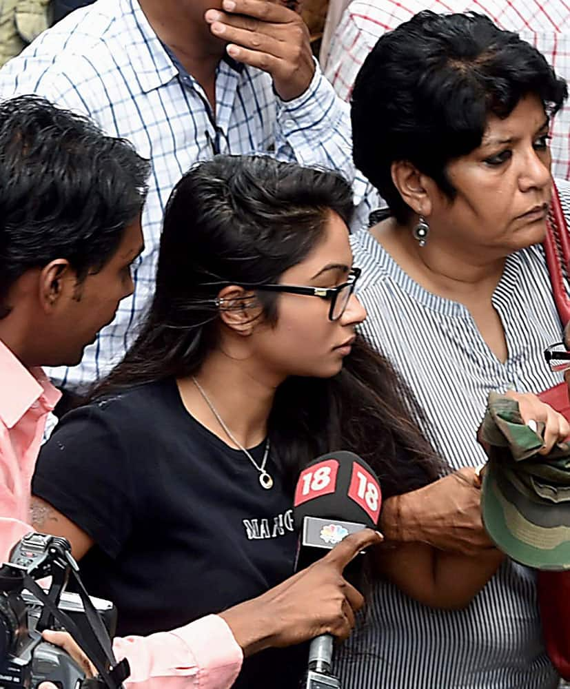 Indrani Mukerjeas daughter Vidhi (in black) arrives at Bandra Metropolitan Magistrate’s court in Mumbai.